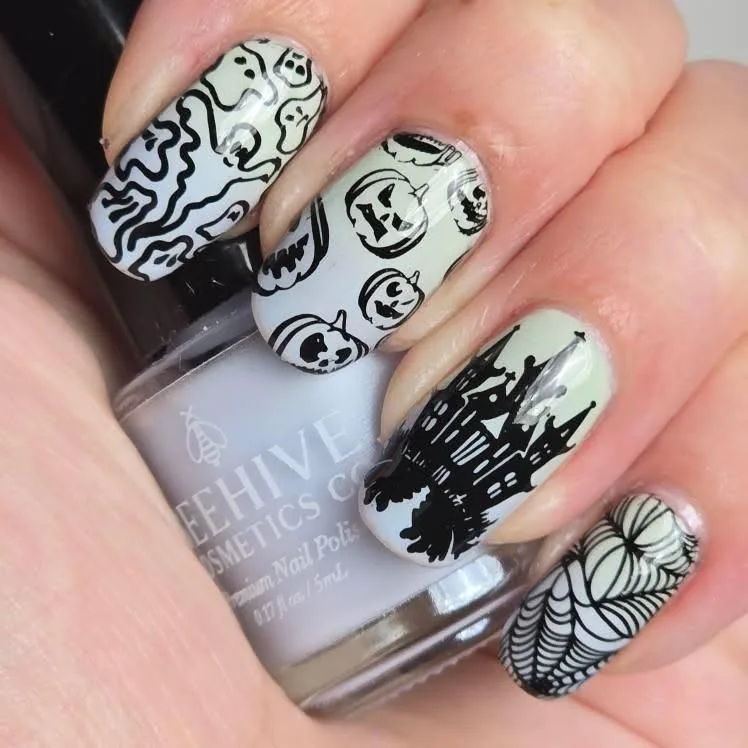 Halloween stamping manicure using Beehive Cosmetics polish; creator attribution remains visible in the image.