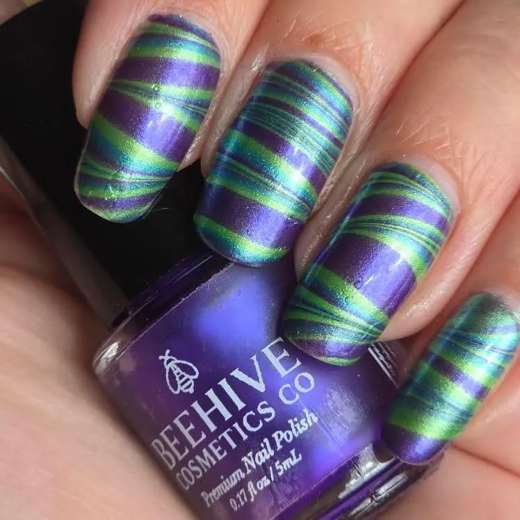 Purple-and-green striped metallic effect demonstrating color separation and finish.
