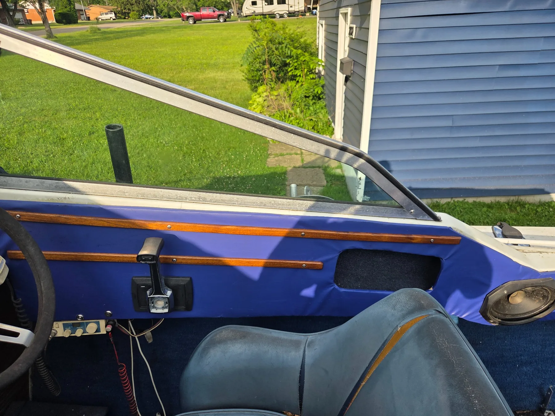 Re-covered side panel with reinstalled controls and trim.