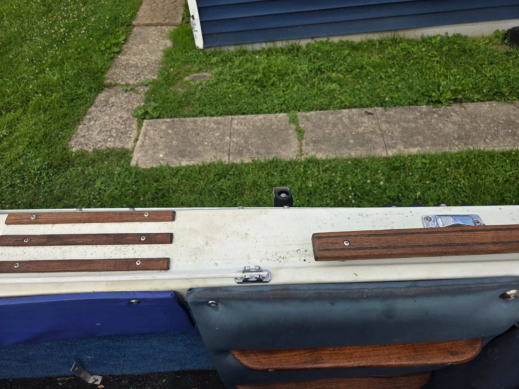 Reinstalled gunwale trim and hardware.