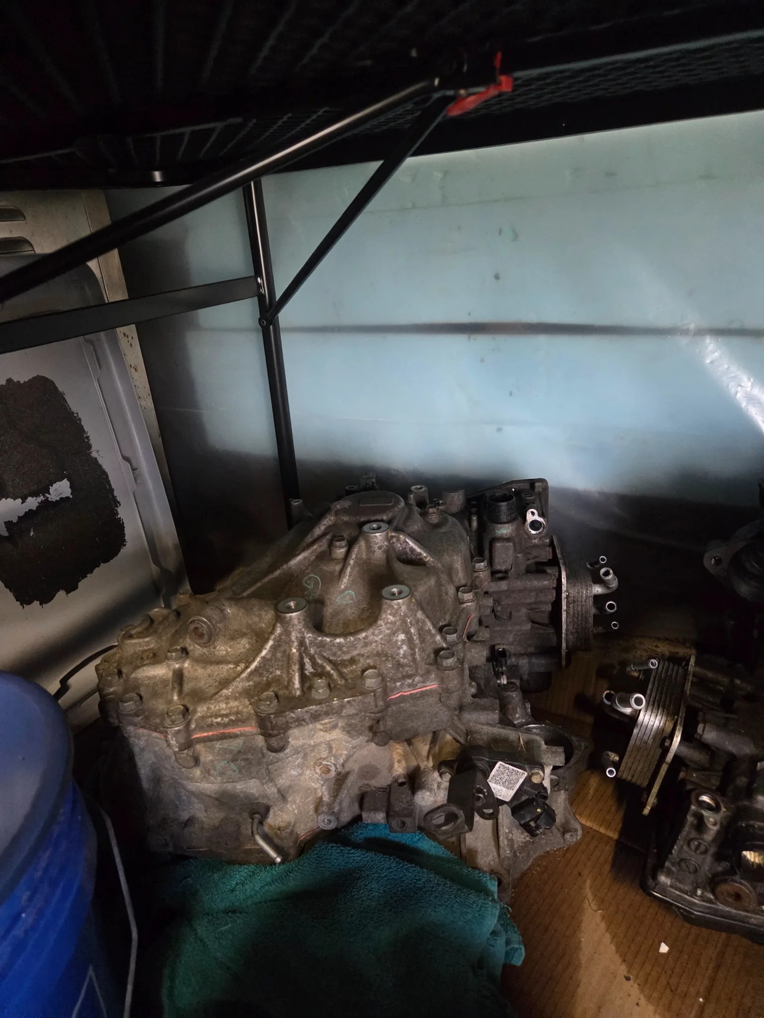 Removed transmissions and drivetrain assemblies stored for diagnosis and parts work.