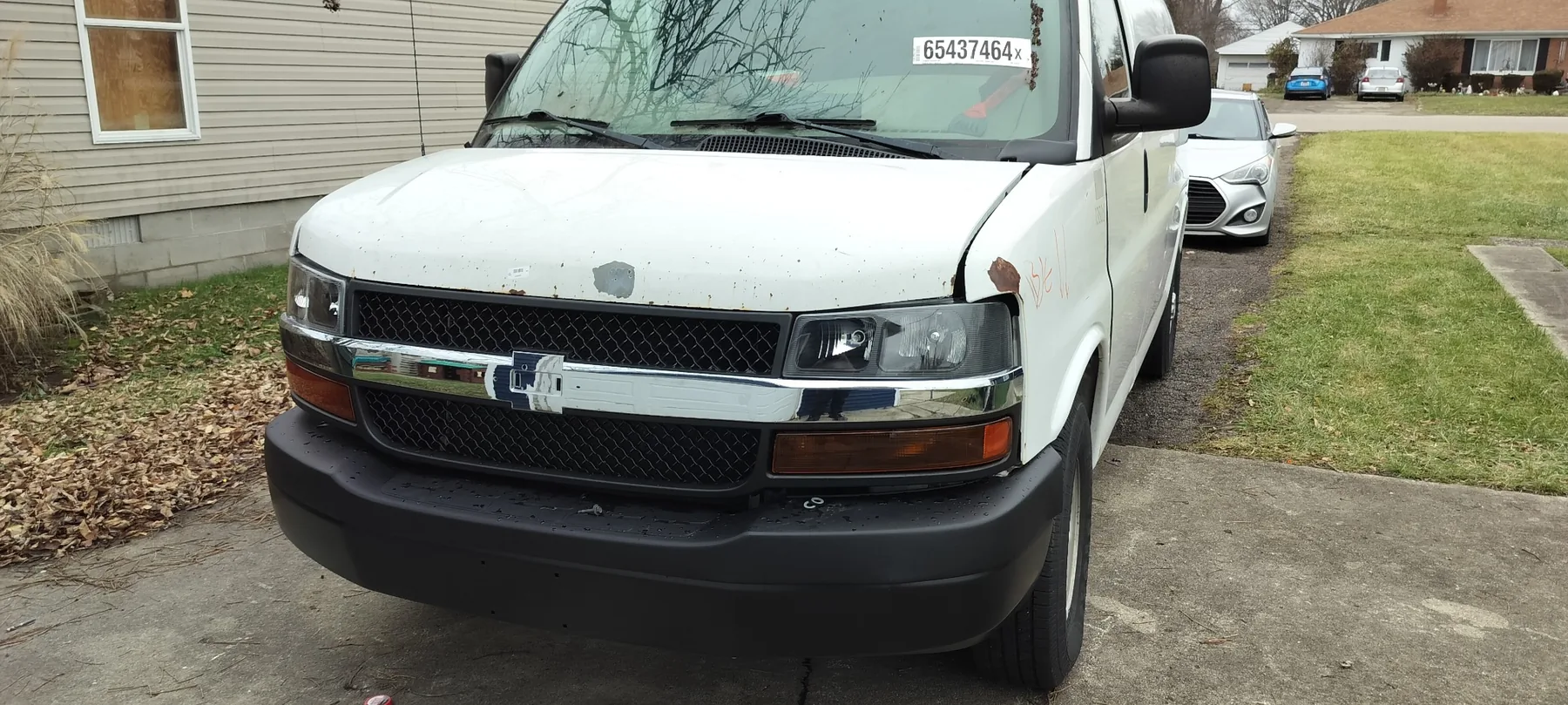 Chevrolet Express van after major mechanical and front-end work.